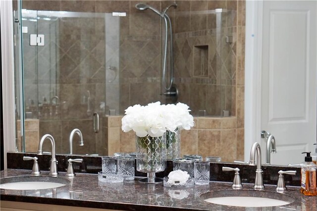 bathroom with an enclosed shower and vanity