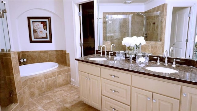 bathroom with vanity, tile patterned floors, and independent shower and bath