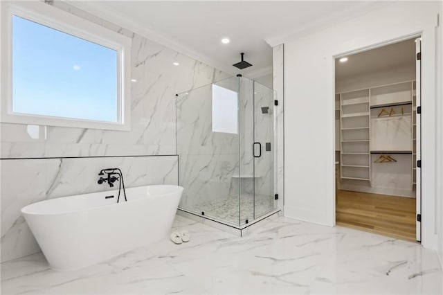 bathroom with independent shower and bath and ornamental molding