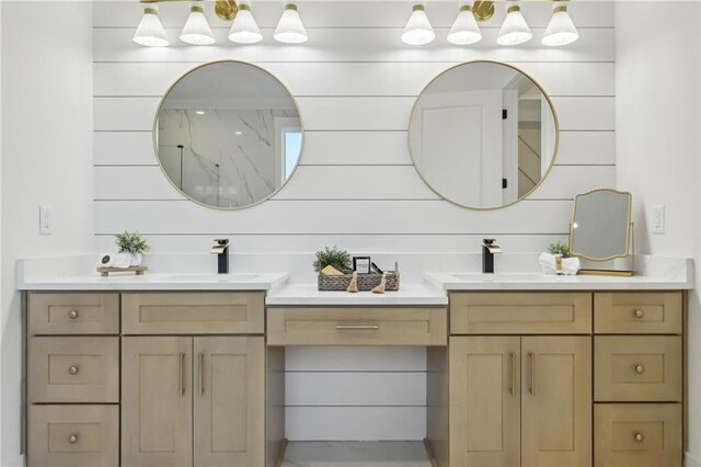 bathroom featuring vanity and wood walls