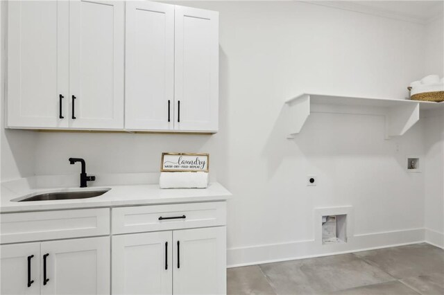 washroom featuring electric dryer hookup, sink, hookup for a washing machine, and cabinets