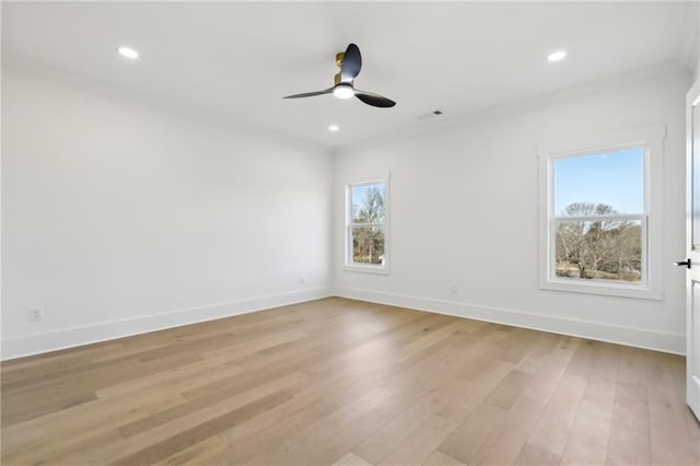 unfurnished room featuring light hardwood / wood-style floors, crown molding, and ceiling fan