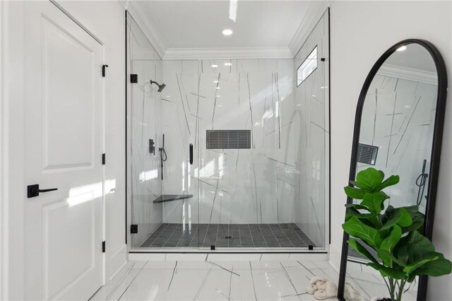 bathroom with an enclosed shower and ornamental molding