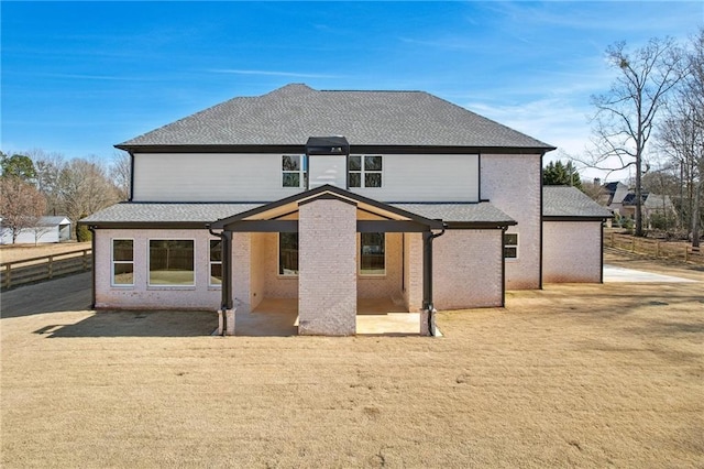 rear view of house featuring a patio