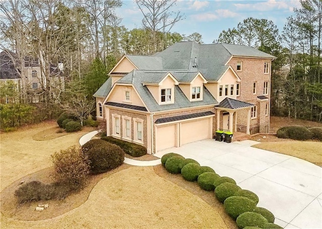 view of front of house featuring brick siding and driveway