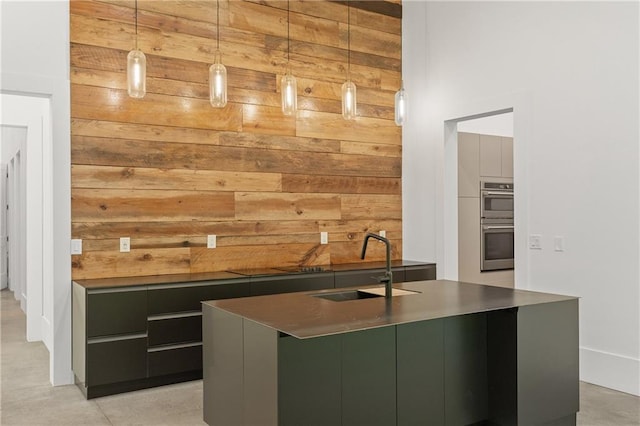 538 Main St, Palmetto, GA 30268 - bar area featuring wood walls, stainless steel double oven, and decorative light fixtures