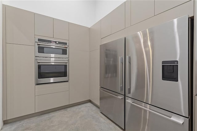 538 Main St, Palmetto, GA 30268 - kitchen with appliances with stainless steel finishes, concrete floors, and gray cabinetry