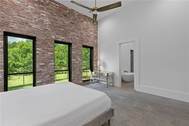 538 Main St, Palmetto, GA 30268 - carpeted bedroom with a high ceiling, ensuite bath, and brick wall