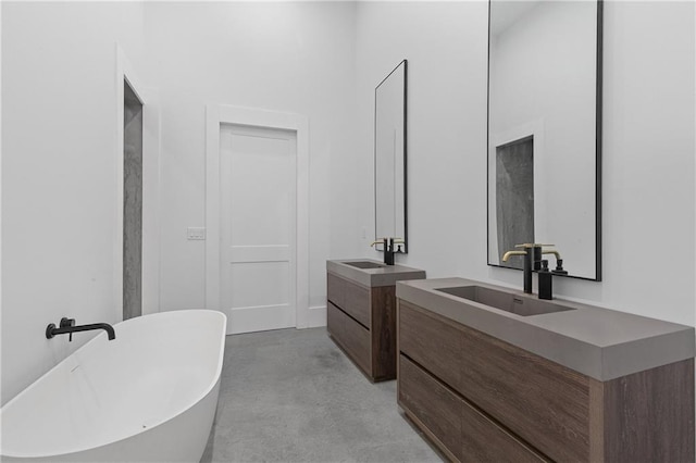538 Main St, Palmetto, GA 30268 - bathroom featuring concrete floors, two vanities, and a soaking tub