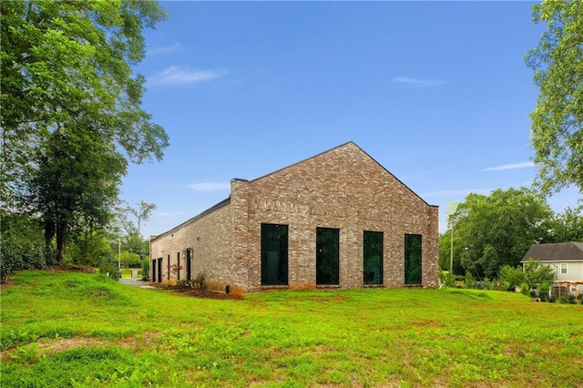538 Main St, Palmetto, GA 30268 - rear view of property featuring a yard