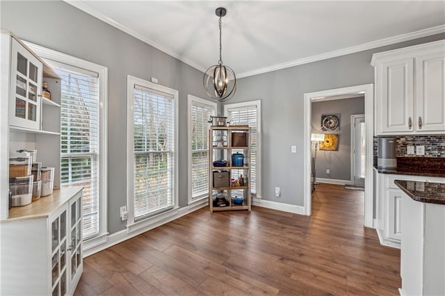 3207 Haleys Way, Conyers, GA 30013 - dining room featuring a chandelier, dark wood finished floors, and ornamental molding