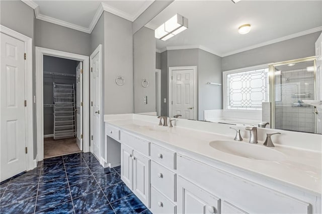 bathroom featuring marble finish floors, a stall shower, double vanity, ornamental molding, and a walk in closet