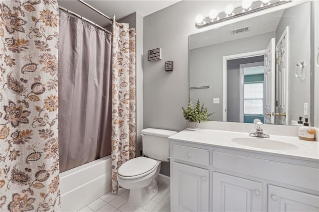 bathroom with tile patterned flooring, toilet, vanity, and shower / bath combo with shower curtain
