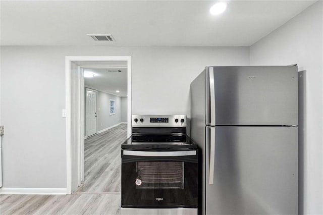 kitchen with visible vents, wood finished floors, recessed lighting, appliances with stainless steel finishes, and baseboards