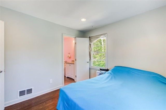 bedroom with recessed lighting, visible vents, ensuite bathroom, dark wood-type flooring, and baseboards