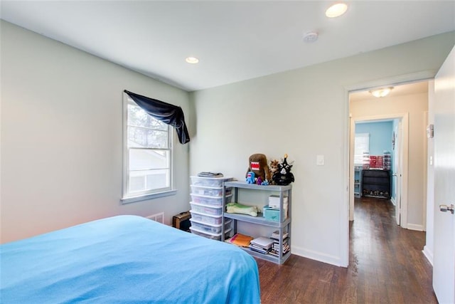 bedroom featuring dark wood-style flooring, recessed lighting, and baseboards