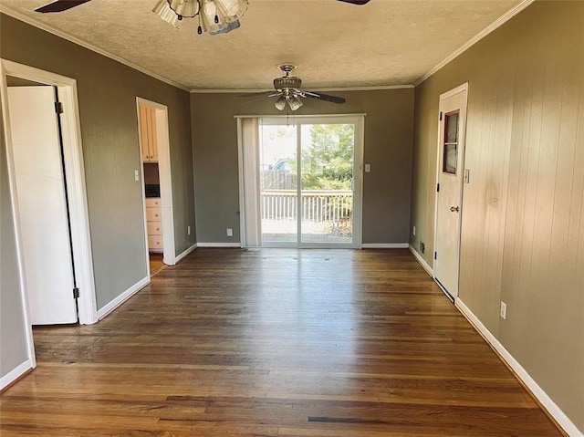 interior space with dark wood-type flooring, ceiling fan, crown molding, and a textured ceiling