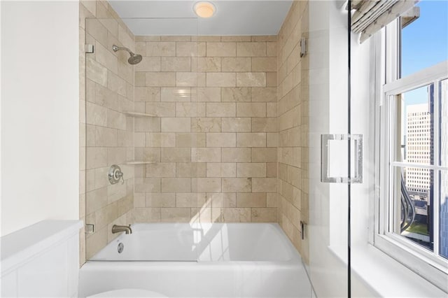 full bathroom with bathing tub / shower combination and toilet