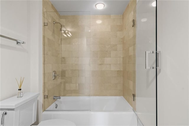 full bath with enclosed tub / shower combo and toilet