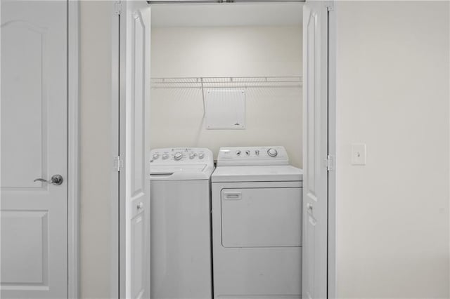 washroom featuring laundry area and washer and clothes dryer