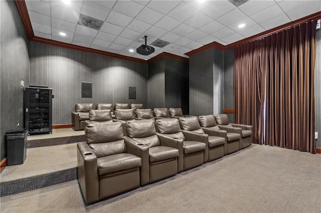 carpeted home theater with recessed lighting, a drop ceiling, beverage cooler, and crown molding