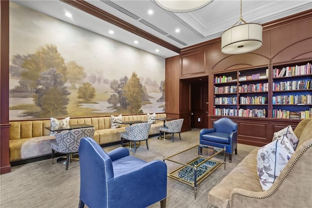 sitting room with recessed lighting, carpet floors, and ornamental molding