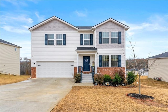 view of front of home with a front lawn and a garage