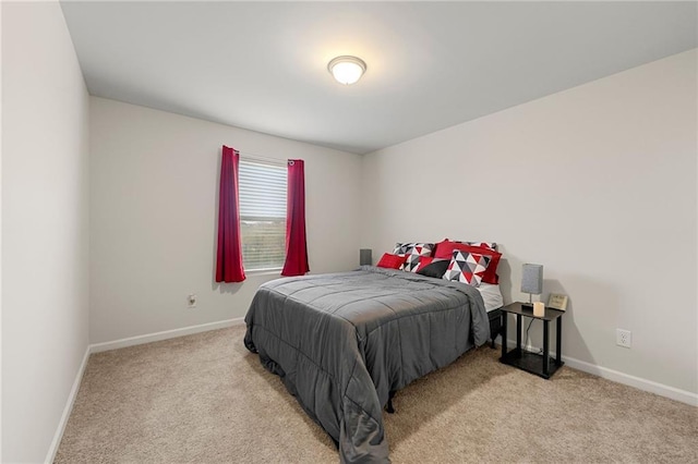 bedroom featuring light colored carpet