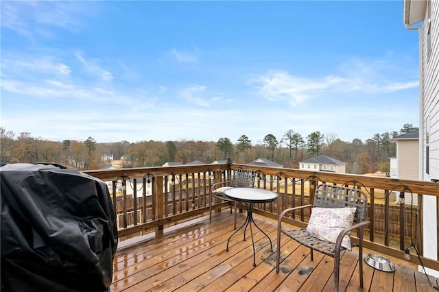 wooden terrace featuring area for grilling