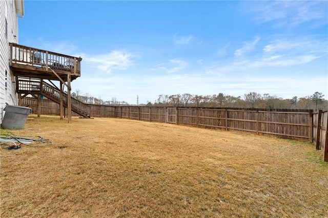 view of yard featuring a wooden deck