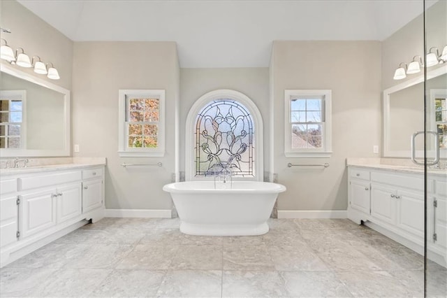 bathroom with a bathtub and vanity