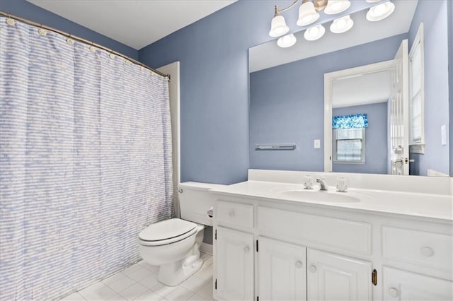 bathroom featuring tile patterned floors, vanity, and toilet