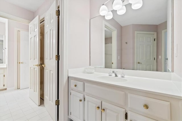 bathroom featuring tile patterned flooring and vanity