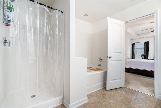 bathroom featuring shower with separate bathtub