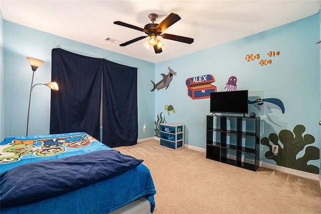 bedroom featuring ceiling fan and carpet