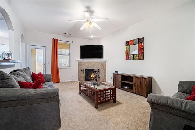 carpeted living room featuring ceiling fan