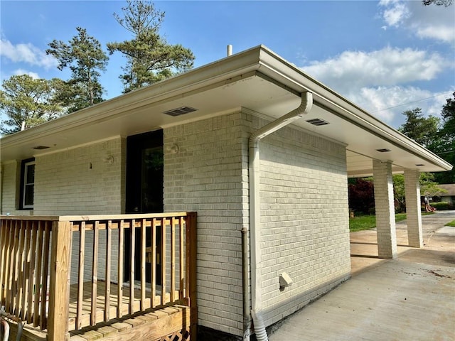 exterior space with brick siding