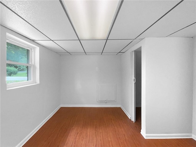 6389 Cumberland Dr, Rex, GA 30273 - spare room featuring wood finished floors, baseboards, and a drop ceiling