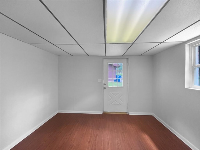 6389 Cumberland Dr, Rex, GA 30273 - empty room with wood finished floors, baseboards, plenty of natural light, and a drop ceiling