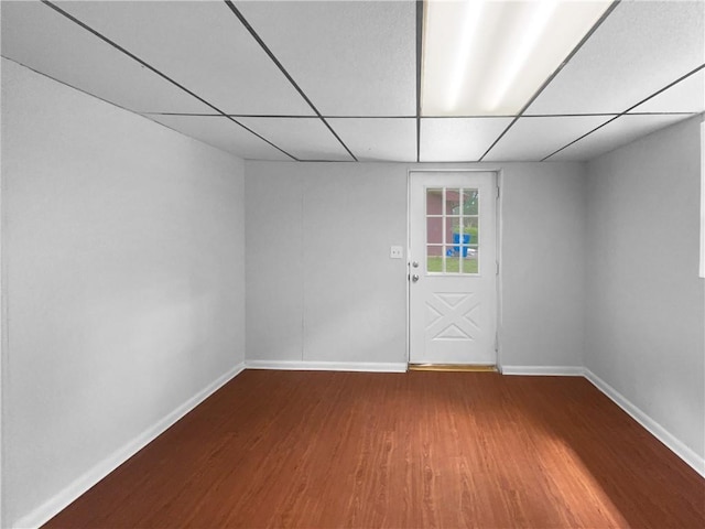 6389 Cumberland Dr, Rex, GA 30273 - spare room featuring wood finished floors, baseboards, and a paneled ceiling