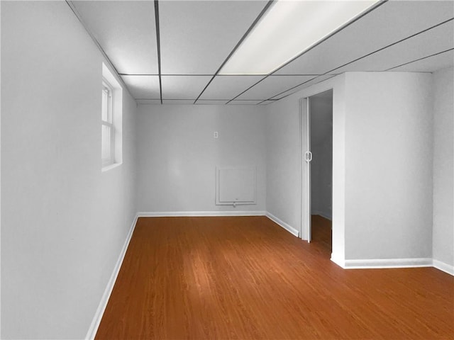 6389 Cumberland Dr, Rex, GA 30273 - unfurnished room featuring baseboards, wood finished floors, and a drop ceiling