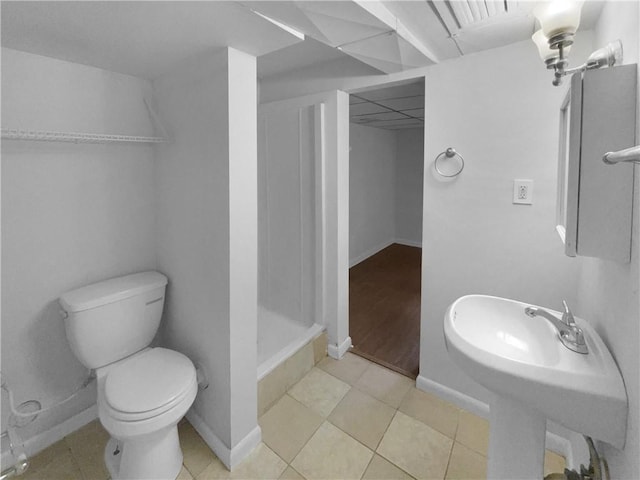 6389 Cumberland Dr, Rex, GA 30273 - full bathroom with toilet, a shower stall, baseboards, a sink, and tile patterned flooring