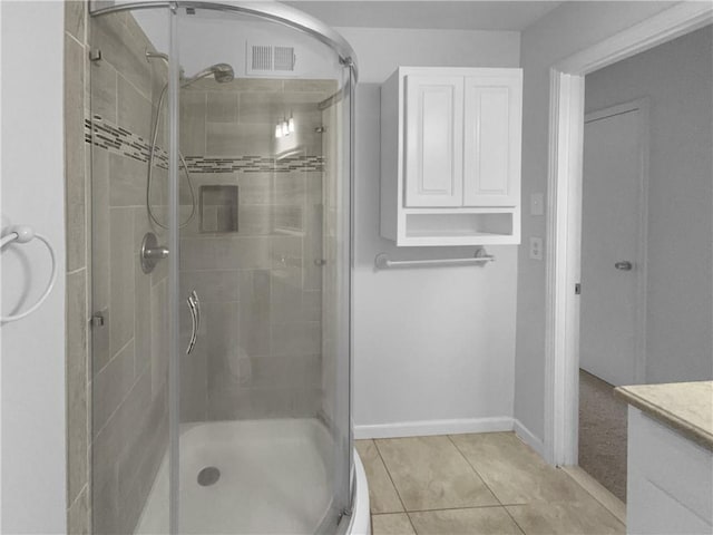 6389 Cumberland Dr, Rex, GA 30273 - full bathroom with a shower stall, tile patterned flooring, vanity, and baseboards