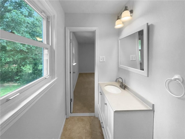 6389 Cumberland Dr, Rex, GA 30273 - bathroom featuring healthy amount of natural light, vanity, and baseboards