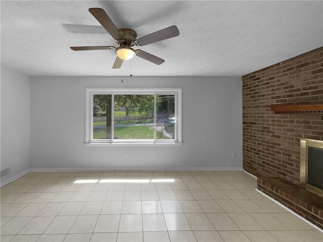 6389 Cumberland Dr, Rex, GA 30273 - unfurnished living room featuring a textured ceiling, baseboards, ceiling fan, and light tile patterned floors