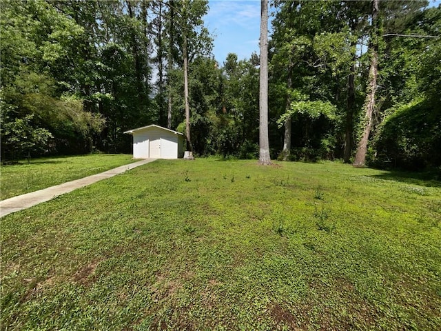6389 Cumberland Dr, Rex, GA 30273 - view of grassy yard with a shed and an outbuilding
