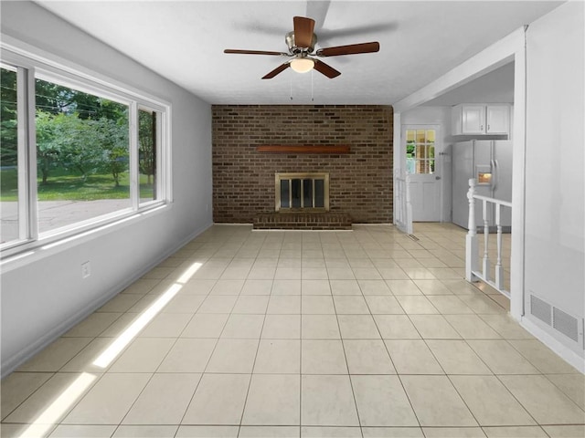 6389 Cumberland Dr, Rex, GA 30273 - unfurnished living room with ceiling fan, a fireplace, light tile patterned floors, and baseboards