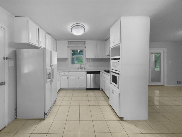 6389 Cumberland Dr, Rex, GA 30273 - kitchen with white appliances, light tile patterned floors, a sink, and white cabinetry