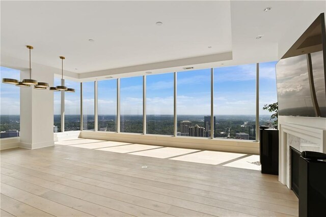 3630 Peachtree Rd NE Unit 3302, Atlanta, GA 30326 - unfurnished sunroom with visible vents, wood finished floors, and a chandelier