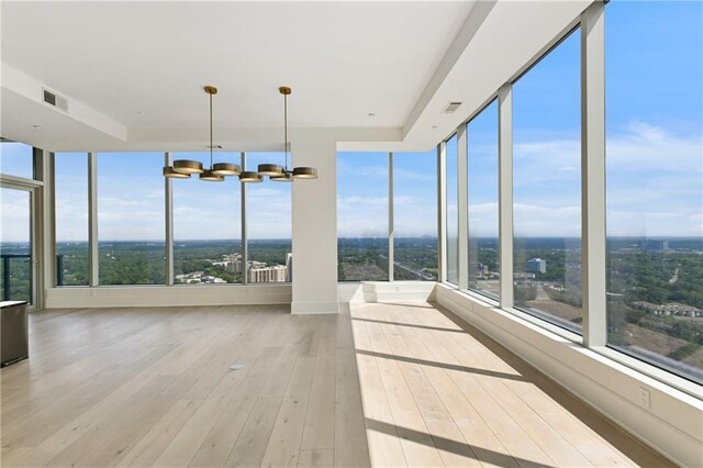 3630 Peachtree Rd NE Unit 3302, Atlanta, GA 30326 - unfurnished living room with recessed lighting, wood finished floors, a chandelier, and a premium fireplace